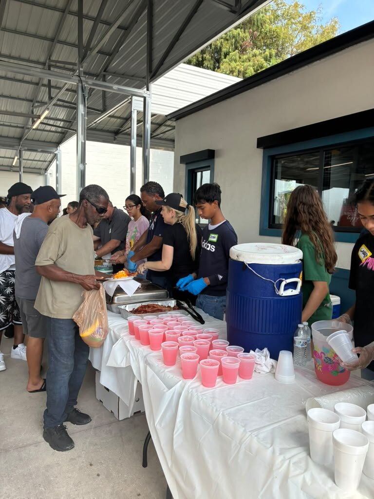 Volunteers preparing meals for the community