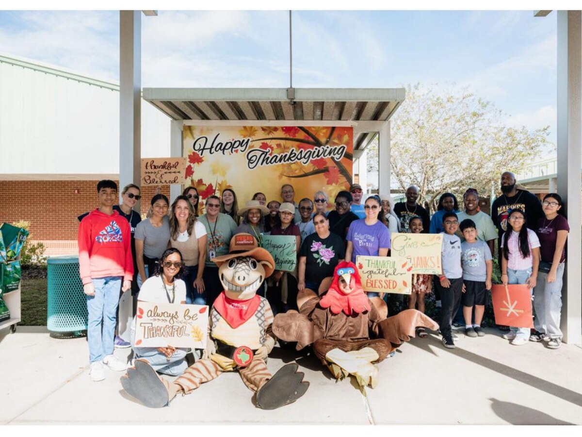 Students and families together at a community Thanksgiving event