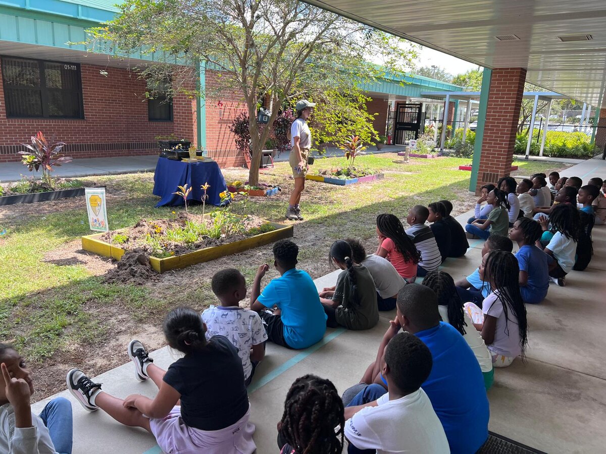 Students gathered outside for an outdoor learning session